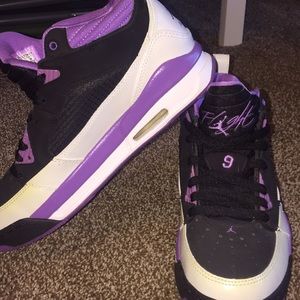 Purple and black Jordan’s.